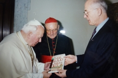 Pope-John-Paul-II-being-presented-with-copy-of-Their-Blood-Cries-Out-on-the-persecution-of-the-church